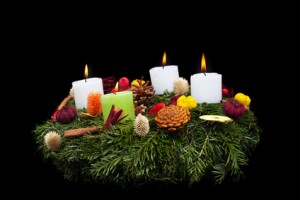 Traditional advent wreath with natural decorations -  isolated on black