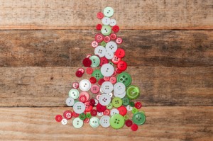 Christmas decoration. Buttons tree on wooden background